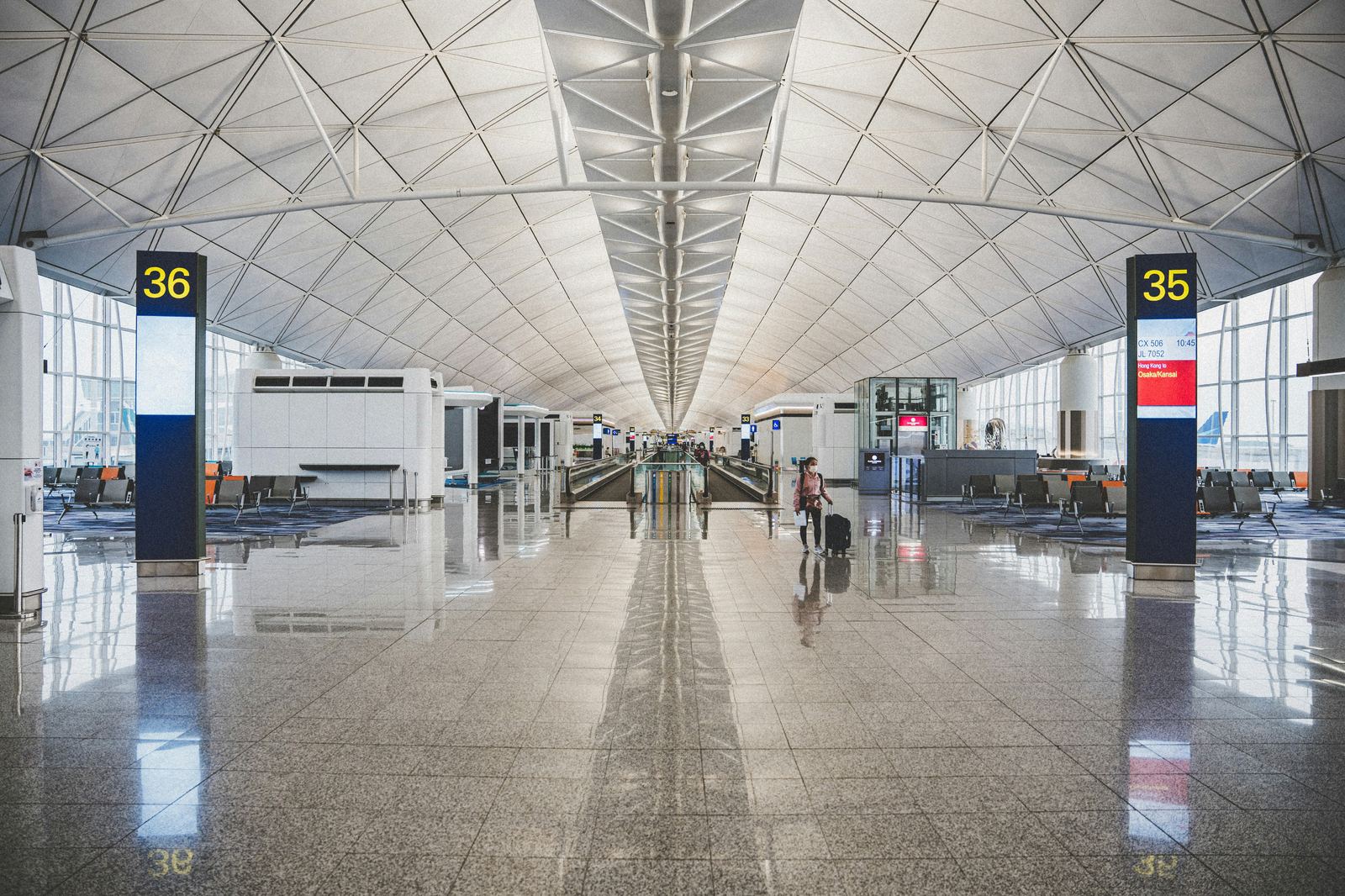 Empty airport terminal hall with a vaulted ceiling
